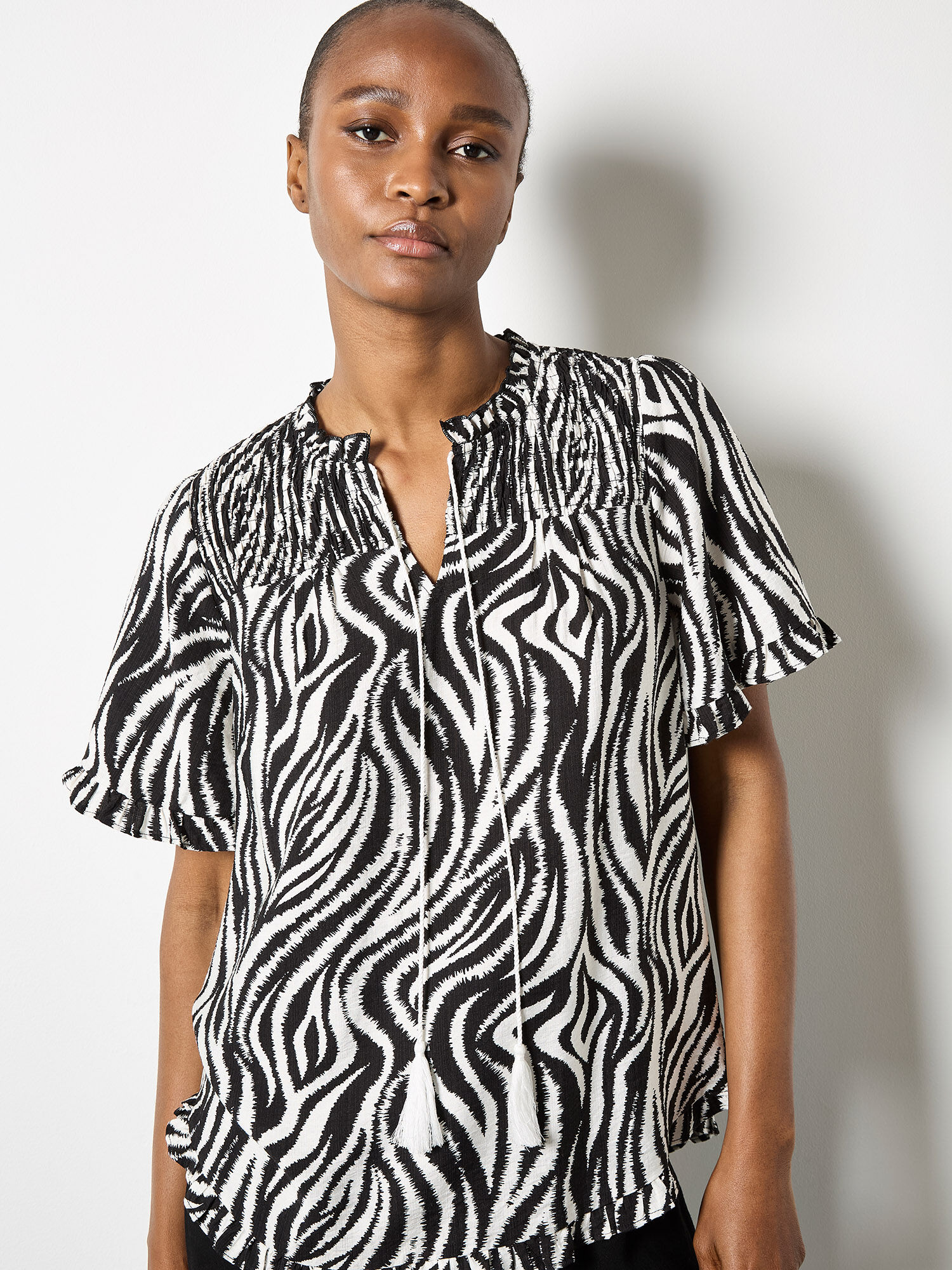 Zebra Swirl Tassel Tie Ruffle Top | Apricot Clothing