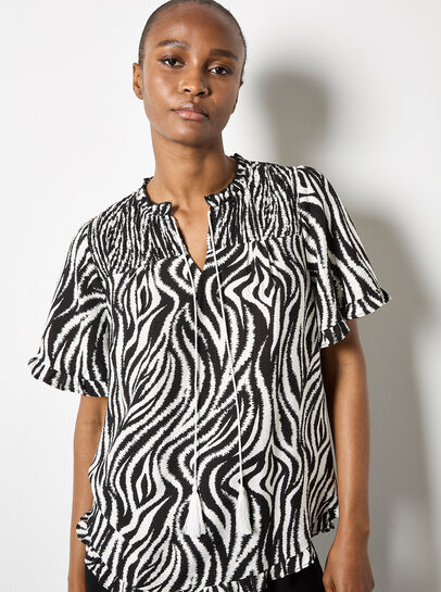 Zebra Swirl Tassel Tie Ruffle Top