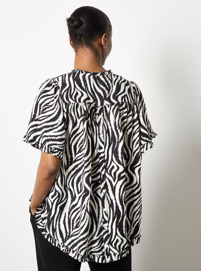 Zebra Swirl Tassel Tie Ruffle Top