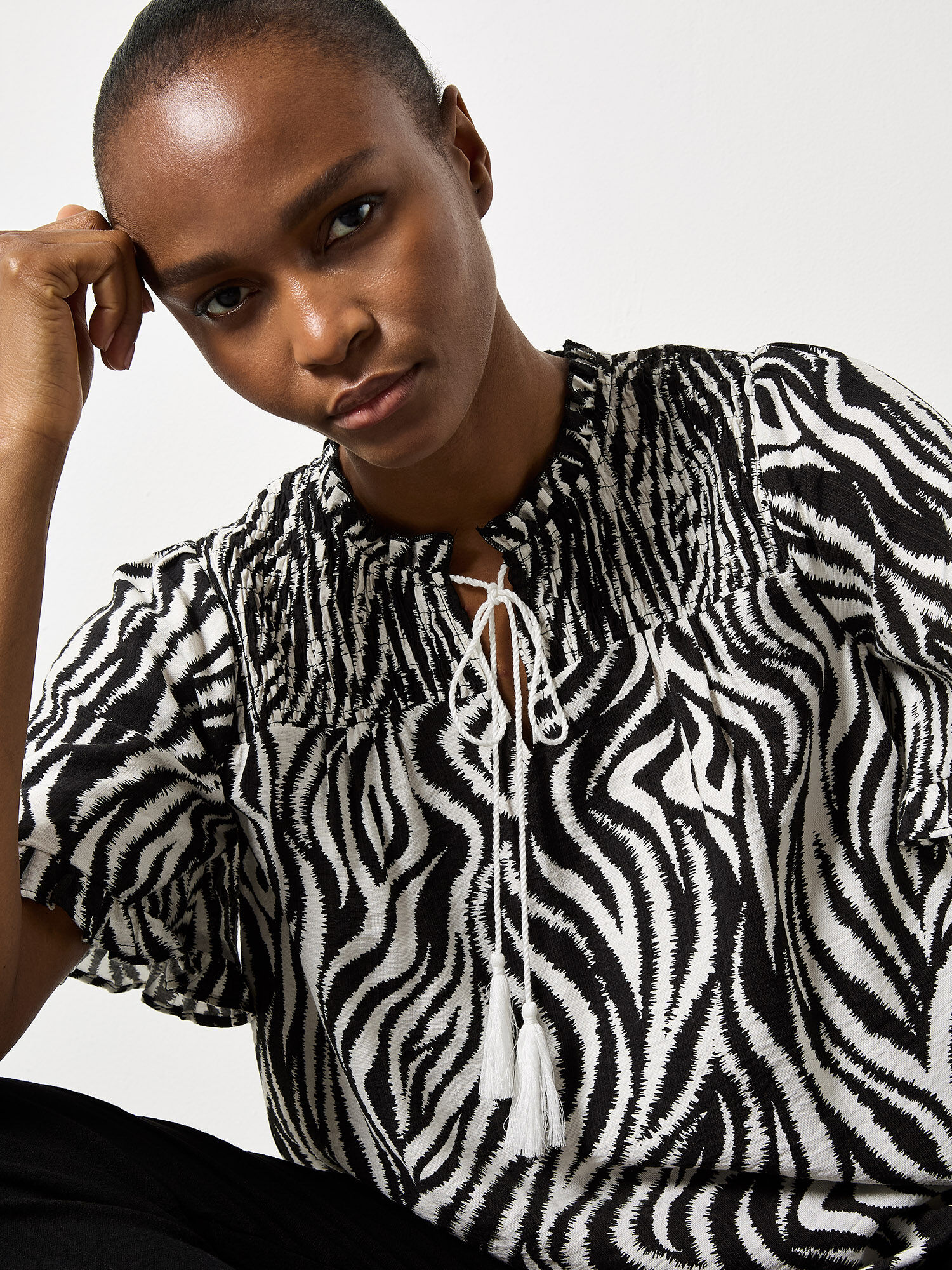 Zebra Swirl Tassel Tie Ruffle Top | Apricot Clothing