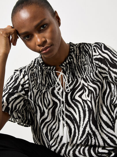 Zebra Swirl Tassel Tie Ruffle Top
