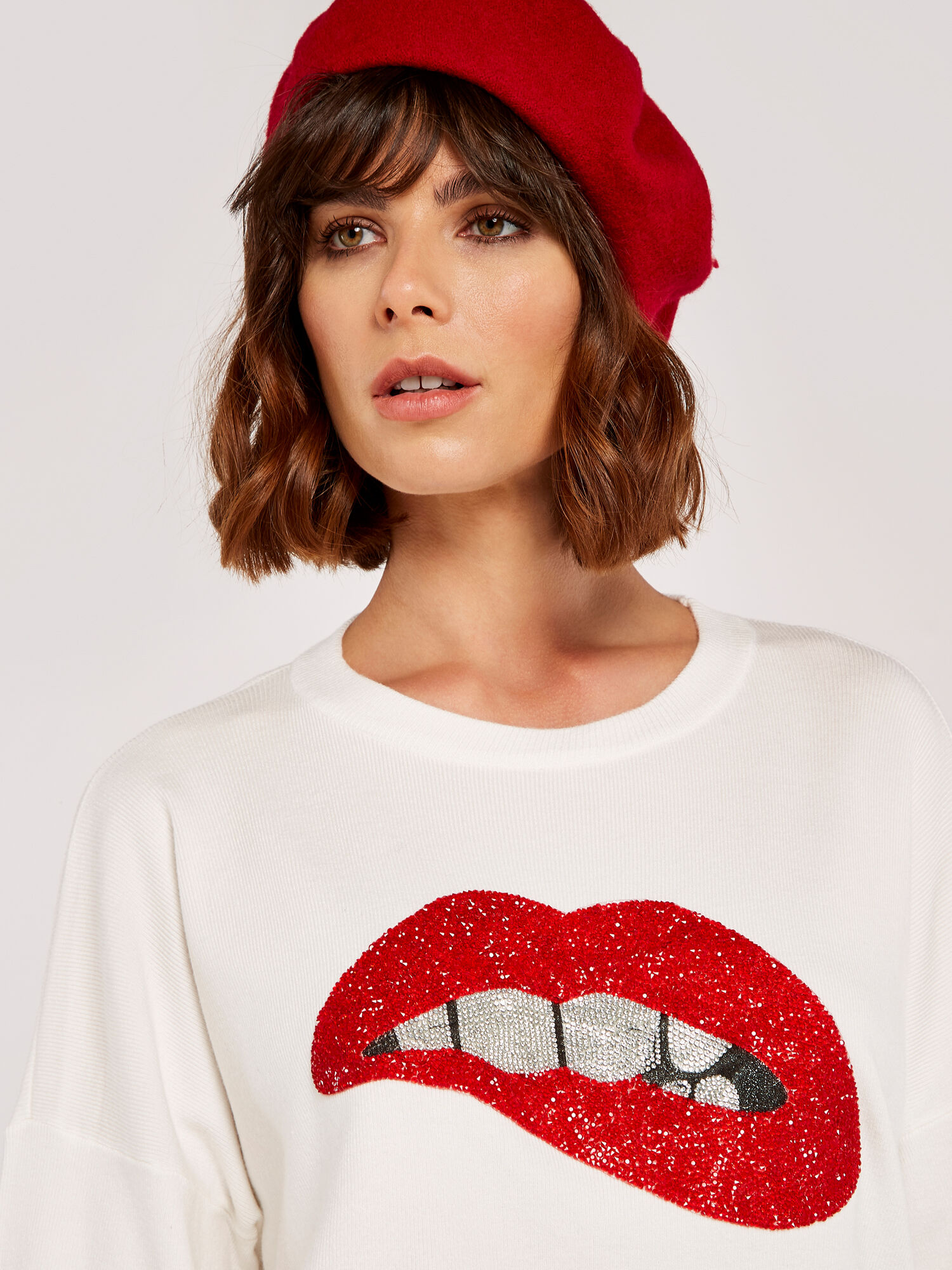 Red jumper with sequin lips best sale