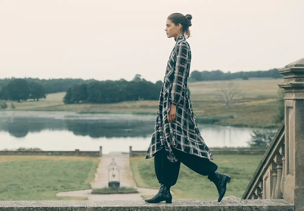 Model wearing a black Check Print flowy Midaxi Dress