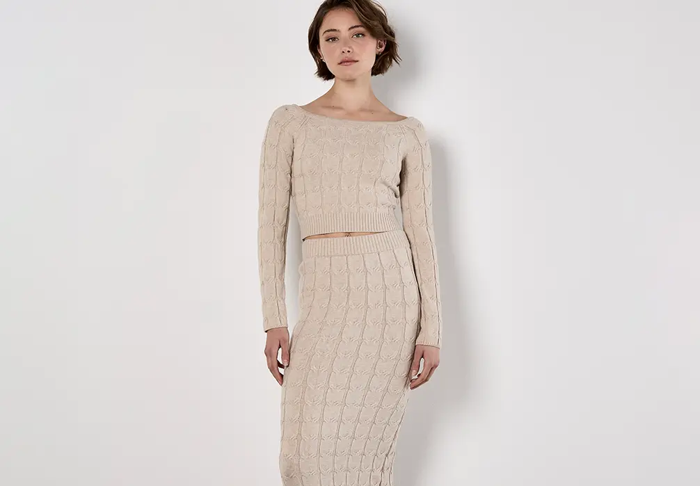 Model is wearing beige knit co-ord