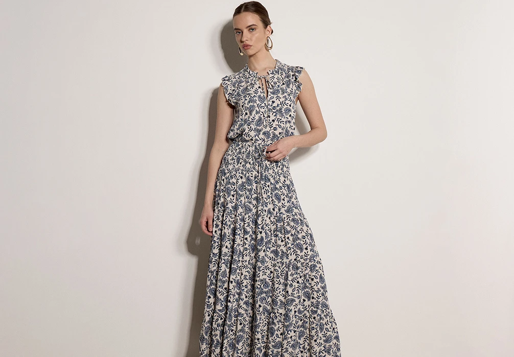 Model wearing Painterly Paisley Tiered Maxi Skirt and matching short-sleeved blouse
