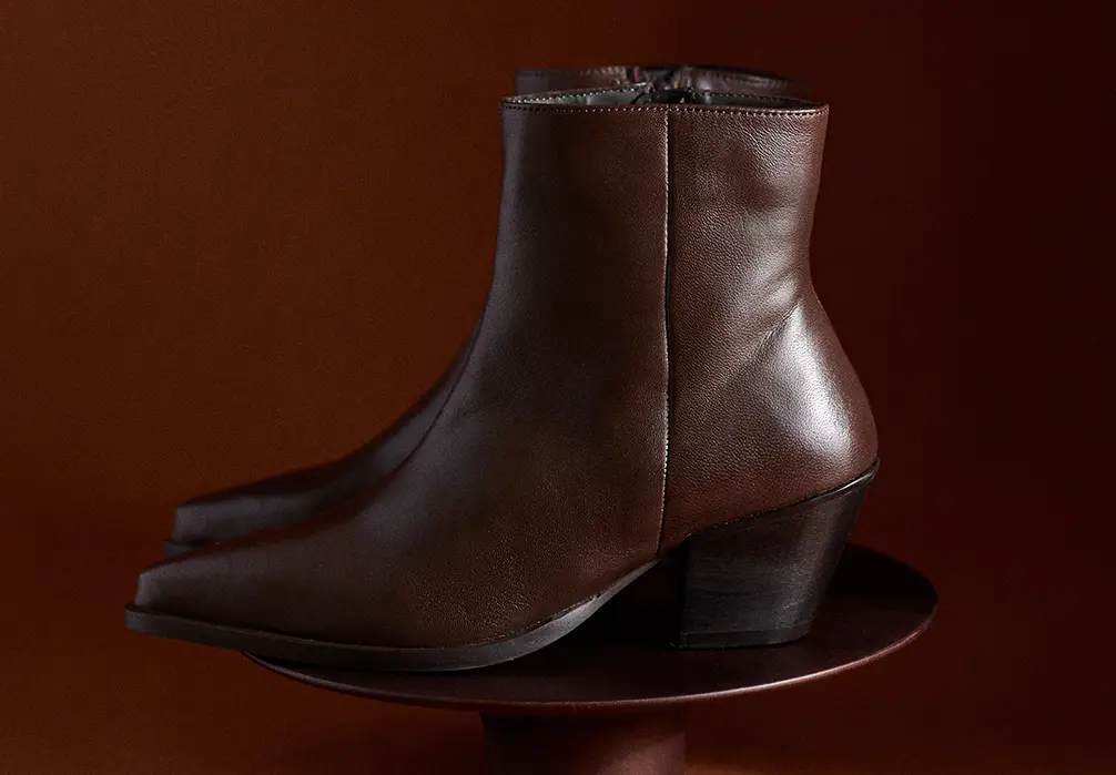 picture shows a brown heeled ankle boot