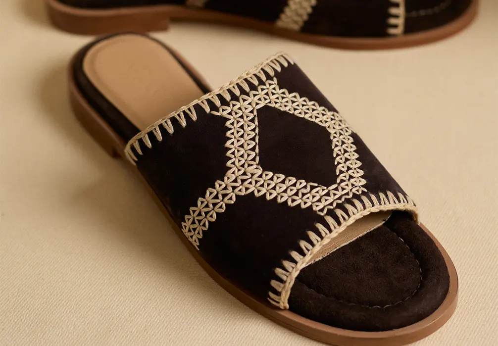 Studio shot of the Suede Raffia Sandals
