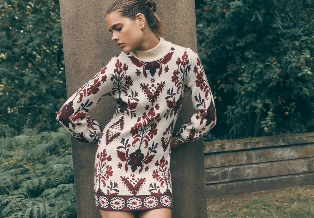 Model is wearing a Knitted Folk Floral mini dress
