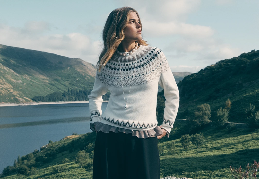 Model is wearing a Folk Floral Mini Jumper Dress