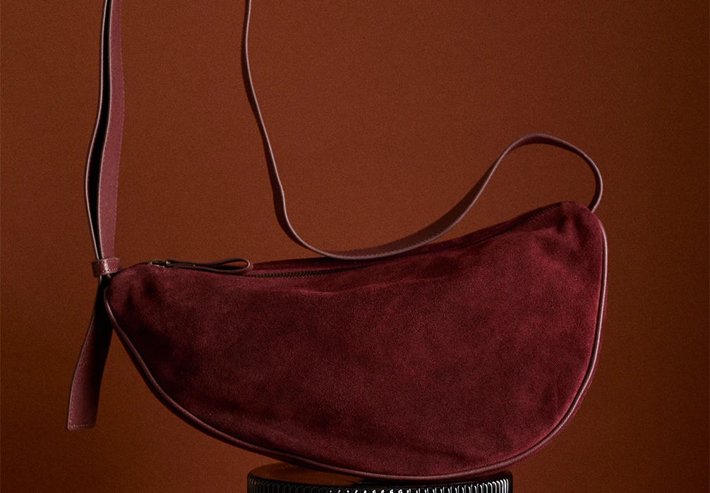 lose up of a pair of the crossbody moon bag