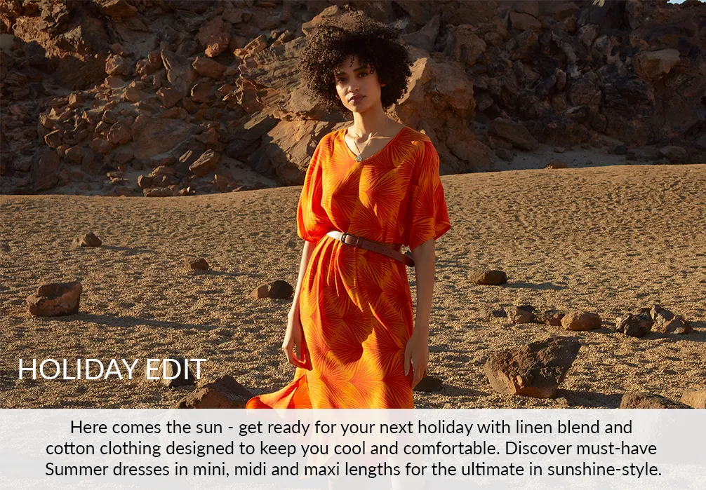 A girl standing in stylish kaftan. Text on image: Here comes the sun - get ready for your next holiday with linen blend and cotton clothing designed to keep your cool and comfortable. Discover must-have summer dresses in mini, midi and maxi lengths for the ultimate in sunshine-style.